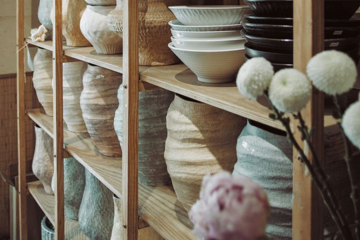 Studio shelves of vases and bowls
